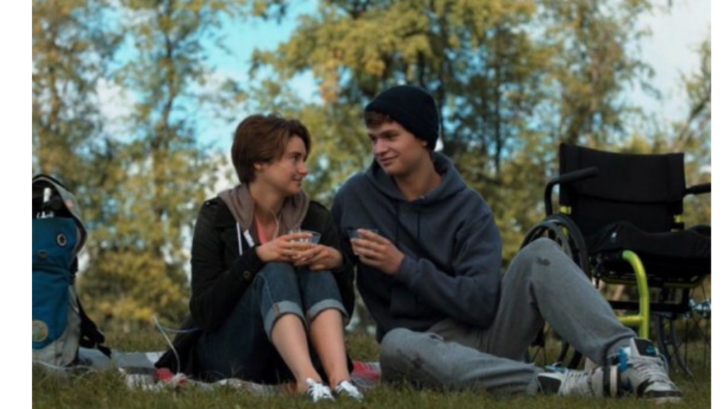 jeunes amoureux assis sur l'herbe